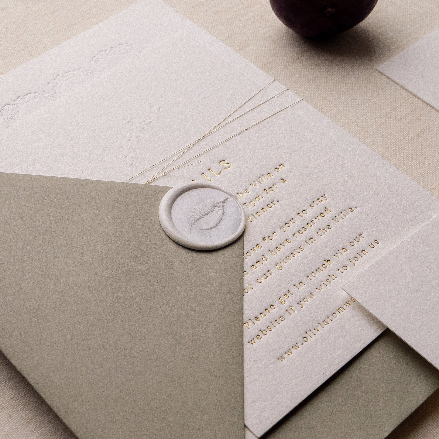 letterpress wedding venue illustration invitation with gold foil text on thick luxe ivory card
