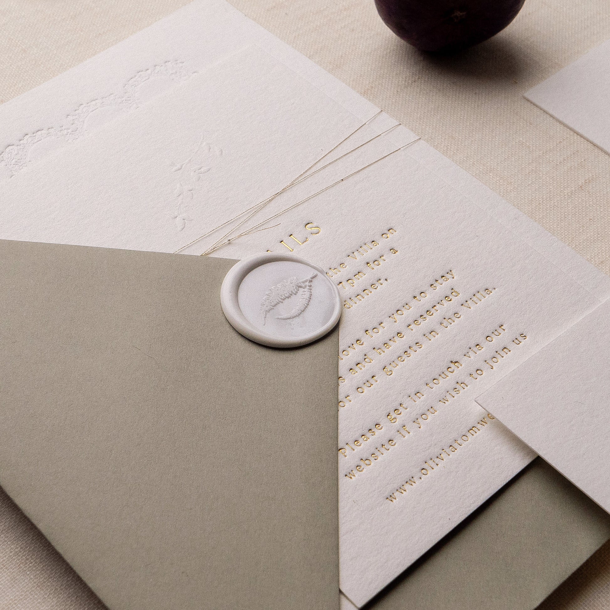 letterpress wedding venue illustration invitation with gold foil text on thick luxe ivory card