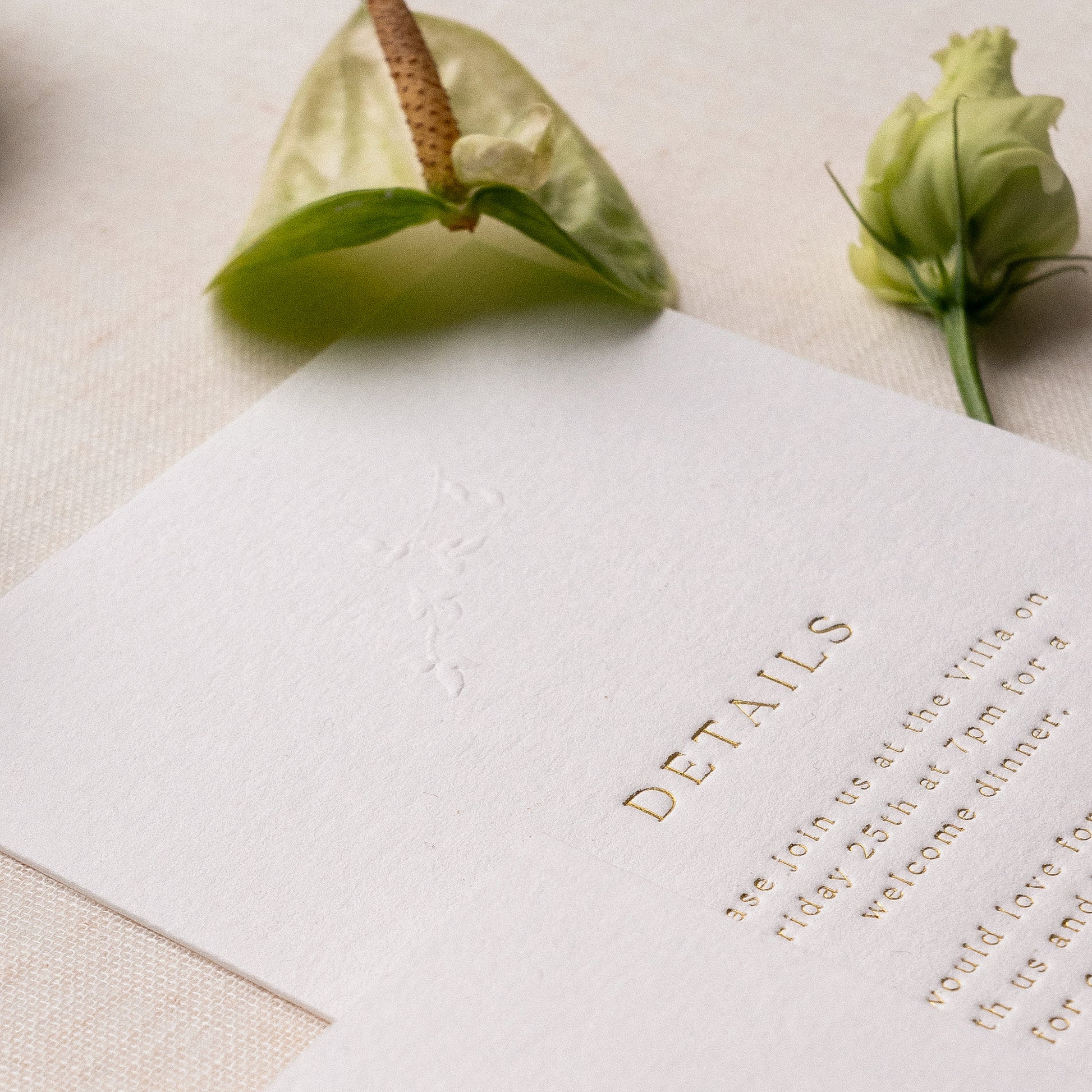 letterpress wedding venue illustration invitation with gold foil text on thick luxe ivory card