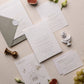 letterpress wedding venue illustration invitation with gold foil text on thick luxe ivory card
