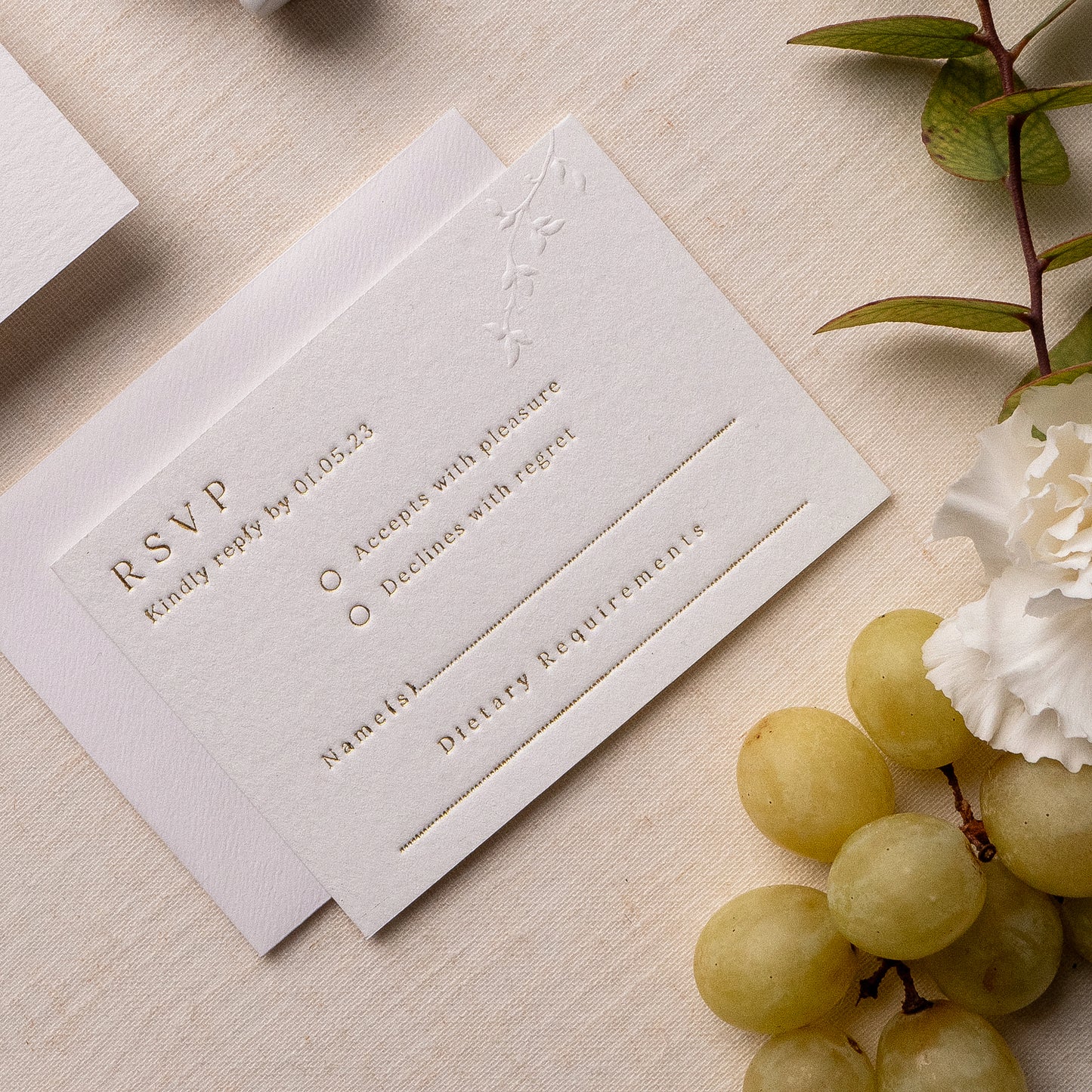 letterpress wedding venue illustration invitation with gold foil text on thick luxe ivory card