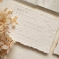 wedding rsvp card with blind letterpress leaf vine printed on handmade cotton paper and styled with beige dried flowers