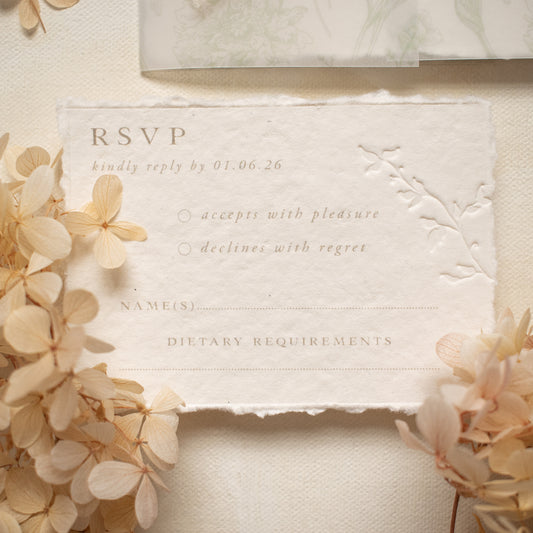 wedding rsvp card with blind letterpress leaf vine printed on handmade cotton paper and styled with beige dried flowers