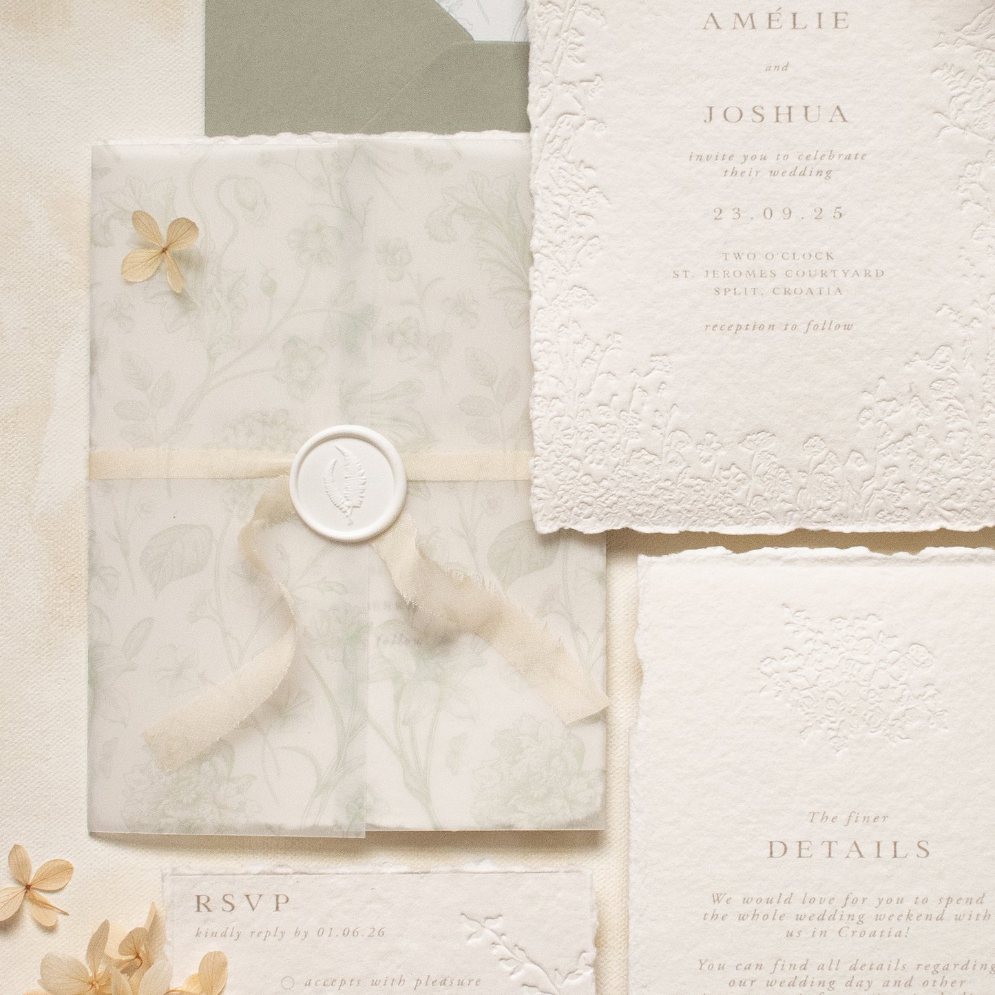 sage green floral vellum wrap with hand dyed silk ivory ribbon and white wax seal for wedding invitations